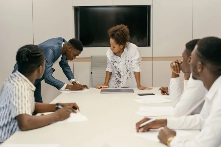 Team working together around a boardroom table